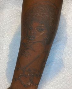 a person with tattoos on their legs