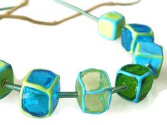 Glass lampwork necklace. Turquoise and green statement necklace. Turquoise Recycled Glass Bead Jewelry, Turquoise Recycled Glass Round Bead Jewelry, Turquoise Recycled Glass Jewelry For Crafting, Turquoise Recycled Glass Jewelry For Jewelry Making, Modern Turquoise Glass Jewelry, Turquoise Glass Beaded Necklaces For Jewelry Making, Green Recycled Glass Beaded Necklace As Gift, Green Recycled Glass Beaded Necklace Gift, Green Recycled Glass Beaded Necklaces For Gifts