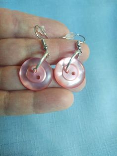 Handmade button dangle earrings to dress up your clothes attire for any dress occasion or everyday wear.  The buttons  are a shiny pinkish rose color,  attached to a jump ring, Earrings with ear wire closure,  Earrings for pierced ears, Gift for mom, gift for sister. Jump Ring Earrings, Pink Drop Earrings, Dress Occasion, Button Earrings, Rose Color, Pierced Ears, Ear Wire, Jump Rings, Sister Gifts