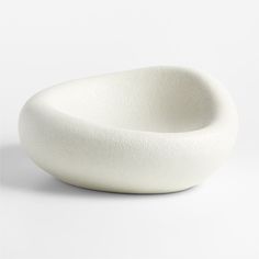 a white bowl sitting on top of a table