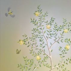 a painting of a tree with yellow flowers and two birds flying above it in the sky