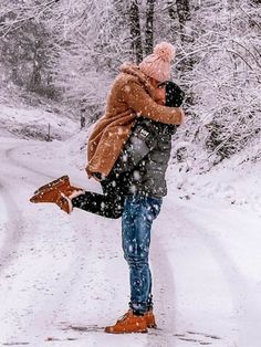 a person walking in the snow carrying a bag