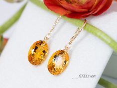 These earrings are composed of the most amazing genuine, natural Madeira Citrines. These red-carpet worthy gemstones are absolutely clean and have an intense golden color. They hang from Solid Gold 14k gold unique earwires that are set with 5 diamonds each. ⭐ DETAILS: ✓ Length including earwires: 1.4″ (about 3.5 cm) ✓ Gold: All the [...] Elegant Oval Citrine Earrings, Citrine Earrings, Natural Citrine, Golden Color, Oval Diamond, Citrine, Red Carpet, Solid Gold, Carpet