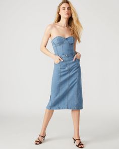 This denim dress combines the casual appeal of blue denim with the sophistication of a bustier top and pencil skirt. Perfect for a cocktail event or dinner out, the midi length offers just the right amount of coverage while still showing off your curves. Bustier denim midi dress Pencil skirt bottom Back zipper closure Length: 35.75" 98% cotton 2% spandex Hand wash Emma is 5ft 10in and is wearing a size small Imported Chic Spring Knee-length Corset Dress, Chic Knee-length Corset Dress For Spring, Chic Knee-length Spring Corset Dress, Knee-length Corset Dress For Date Night, Fitted Midi Length Denim Dress, Fitted Denim Blue Midi Length Dress, Fitted Denim Blue Midi Denim Dress, Fitted Midi Denim Dress In Denim Blue, Summer Party Denim Dress Midi Length