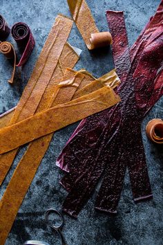 the tools are laying out on the table to be used for making paper flowers and ribbons