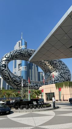 a large metal sculpture in front of a building