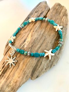 "This gorgeous boho beach ankle bracelet is so fun and stylish! Ready for summer fun! Made with different variations of turquoise stones and beads with howlite stone starfish beads! It has gorgeous silver tibetan beads through out an extension chain with a silver charm of your choice. Choose which one you would like in the drop down menu. The last listing photo shows the charms to choose from. Your pretty ankle bracelet will come packaged in a gift box.. Perfect for gift giving or keeping! :-) M Ankle Bracelets Boho, Ankle Bracelets Diy, Beaded Ankle Bracelets, Beach Bracelet, Boho Wrap Bracelet, Beaded Ankle, Your Pretty, Beach Bracelets, Howlite Stone