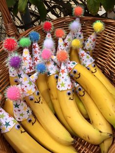 bunches of bananas with decorations on them in a basket