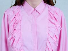 "AUNT GERTRUDE PRESENTS - vintage long sleeve pink shirt - frill at the front - materials: polyester CONDITION (1-10 ❶❷❸❹❺❻❼❽❾ Great condition SIZE/MEASUREMENTS size from label: 44 best fits: XL/XXL shoulder to shoulder: 16 inches (40 cm) bust: 44 inches (112 cm) length: 27 inches (68 cm) sleeve length from armpit: 18,5 inches (47 cm) The model is 5'9\" (174 cm), measures 35-27-38 (90-69-96 cm) and wears size M" Feminine Long Sleeve Shirt For Spring, Chic Long Sleeve Ruffled Shirt, Pink Long Sleeve Top For Daywear, Long Sleeve Ruffled Tops For Summer, Pink Ruffled Collar Top For Summer, Feminine Long Sleeve Shirt For Daywear, Pink Long Sleeve Feminine Top, Feminine Pink Long Sleeve Top, Pink Collared Top With Ruffles