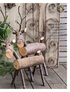 three wooden reindeer chairs sitting next to each other on a wood floor near a fence