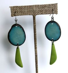 "These very light earrings in turquoise blue and lawn green are a breeze to wear. Lots of movement and a splash of color from these natural tagua beauties! The earrings are long. Each pair is a little different but on average they measure 2 3/4\"." Green Dangle Earrings For Beach, Turquoise Nature-inspired Drop Earrings, Unique Green Teardrop Earrings, Nature-inspired Blue Dangle Earrings, Nature-inspired Turquoise Dangle Earrings, Nickel-free Green Earrings For Beach, Nature-inspired Green Teardrop Earrings, Unique Green Pierced Earrings, Blue Nature-inspired Drop Earrings