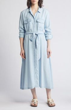 Timeless polish meets ultimate comfort in a button-front midi shirtdress cinched with a matching belt and cut from fresh, lightweight chambray. 47" length (size medium) Front button closure Spread collar Long sleeves with button cuffs Chest flap-patch pockets; side-seam pockets 100% Tencel® lyocell Tencel lyocell is a more-sustainably produced fiber made with closed-loop processing Machine wash, line dry Imported Spring Collared Shirt Dress With Roll-up Sleeves, Casual Button-up Maxi Dress With Pockets, Summer Button-up Maxi Dress With Pockets, Summer Button-up Midi Dress With Pockets, Summer Button-up Midi Dress With Belted Cuffs, Elegant Spring Shirt Dress With Roll-up Sleeves, Spring Knee-length Midi Dress With Belted Cuffs, Spring Belted Shirt Dress With Spread Collar, Casual Collared Maxi Dress With Pockets