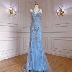 a dress on display in a room with chandeliers