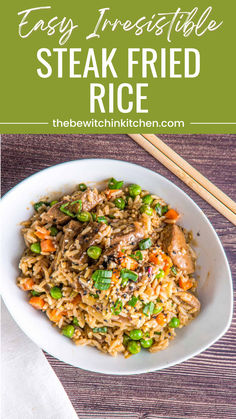 a white bowl filled with fried rice and vegetables next to chopsticks on a wooden table