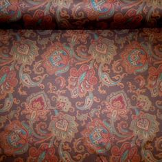 the fabric is very colorful and has paisley designs on it