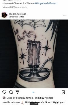 a tattoo on the arm of a person with an image of a candle in it