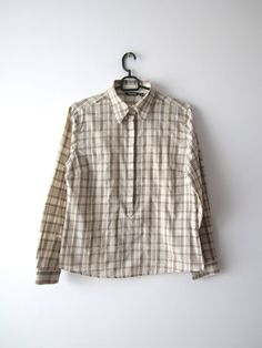 "Vintage Women's Plaid Shirt Button Up Long Sleeve Blouse Large Size Checkered Beige Shirt Comfortable Everyday Shirt Grandma Blouse Label size: 12 estimated size: L  Measurements (lying flat): Shoulders: 18\" / 46 cm Bust: 20.5\" / 52 cm Waist: 22\" / 56 cm Length: 30.5\"/ 77.5 cm Sleeve: 24\" / 61 cm Please check measurements to insure a proper fit. Remember to allow yourself some extra room for movement. You can compare these with something from your closet that fits you well. This blouse will come to you freshly laundered and ready to wear. Please convo me if you need additional measurements. Condition:  Great Vintage Condition SHIPPING * I ship worldwide via Priority mail (Latvijas Pasts) from Latvia (EU). * I ship from Europe, so please allow 2 to 4 weeks for the package to arrive if Beige Spread Collar Shirt, Beige Spread Collar Shirt For Daywear, Beige Shirt With Spread Collar, Beige Buttoned Shirt For Daywear, Beige Shirt With Spread Collar For Daywear, Collared Plaid Blouse For Daywear, Plaid Blouse With Button Closure For Daywear, Classic Collared Plaid Blouse, Classic Plaid Collared Blouse