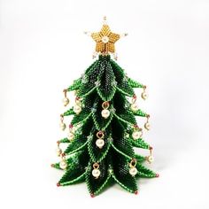 a small christmas tree made out of beads