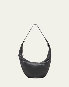 Khaite "Augustina" hobo bag in calfskin leather     Adjustable shoulder strap    Zip top closure     Approx. 8.5"H x 14.5"W x 3"D    Made in Italy Chic Calf Leather Hobo Bag With Detachable Strap, Evening Leather Hobo Bag With Detachable Strap, Leather Hobo Bag With Detachable Strap For Evening, Chic Calf Leather Hobo Bag With Removable Pouch, Chic Calf Leather Hobo Bag With Adjustable Strap, Chic Calf Leather Crossbody Hobo Bag, Calf Leather Hobo Bag With Soft Leather For Travel, Soft Calf Leather Hobo Bag For Travel, Luxury Leather Lined Crossbody Hobo Bag