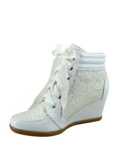 a pair of white wedged shoes with sequins