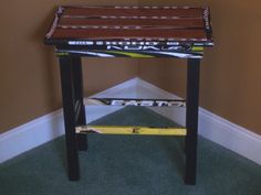 a small wooden table sitting on top of a carpeted floor