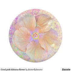 a white and pink flower on top of a glass plate with glittery paint splattered around it