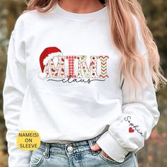 The Mimi Clause Christmas sweatshirt is the perfect way to celebrate the holidays with your grand kids. Made from soft and cozy material, this sweatshirt is designed to keep you warm and comfortable all winter long. Personalized with the names of your grand kids on the sleeves, this sweatshirt is a great way to show off your love and pride for your family. Whether you're spending time with your grand kids or just relaxing at home, this sweatshirt is sure to become a favorite. So why not add a touch of personalization to your holiday wardrobe with the Grandma Clause Christmas sweatshirt? Made from a combination of high-quality polyester and cotton, these garments are perfect for any occasion. With their super-soft fabric and relaxed fit, they provide unbeatable comfort all day long. Plus, t Gigi Gift, Mimi Gift, Love And Pride, Holiday Wardrobe, Grandchildren, Christmas Sweatshirts, Kid Names, Sew-in Labels, Soft Fabrics