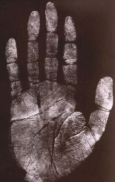 an image of a hand that has been drawn on the ground with it's fingers