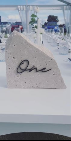 there is a rock with the word love on it sitting on top of a table