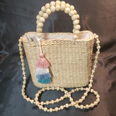 Nwot Woven Handbag Wood Beaded Handle With 4" Drop Small Wood Beaded Strap With 25" Drop Zip Close Neutral Fabric Lining Removable Pink, Blue And Cream Tassel 8"W X 8"H X 3.5"D Perfect Neutral Tone For Any Summer Outfit Summer Beaded Beige Bags, Beaded Beige Straw Bag, Summer Beaded Natural Shoulder Bag, Natural Beaded Shoulder Bag For Summer, Cream Beaded Summer Bag, Cream Beaded Bag For Summer, Vacation Beaded Beige Shoulder Bag, Beaded Cream Bag For The Beach, Beaded Natural Straw Bag For Beach