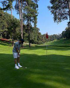 a man is playing golf on the green