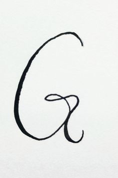 the letter g is drawn in black ink on white paper with a pen and pencil