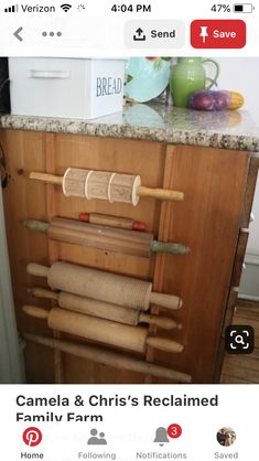 a kitchen counter with rolling dough and rolling pins on top of it next to a tea kettle