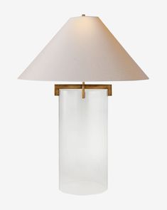 a glass lamp with a white shade on the bottom and a gold metal frame around it