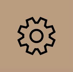 a black and white image of a cogwheel on a brown background with the letter o in the center