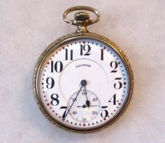 "Antique Illinois Springfield Watch Co. Open Face Pocket Watch, Gold Filled Case (No Monogram). Working.  Illinois serial number 4557188.  Production year circa 1925. Wonderful used vintage/antique condition with some normal light signs of wear/use.   Working condition.   This pocket watch appears to run just fine.   It ran for several hours before and during the time I was listing.  It was still running when I put it away.  Not tested for accuracy, no guarantee, but again appears to work just fine.   Often these pocket watches need to be serviced/cleaned for total accuracy. Watch details; Open Face. Size 16S. Model 7. Grade 606. This watch measures 49mm wide at the center. The works measures approximately 40mm in wide. 21 jewels.  Pendant movement setting, 3/4 plate. Adjusted - Yes. Doubl Classic Formal Watch Accessory With Stopwatch, Timeless Stopwatch Watch As Gift, Timeless Watches With Stopwatch As Gift, Timeless Watches With Stopwatch For Gift, Timeless Gift Watches With Stopwatch, Classic Round Stopwatch Watch, Classic Round Watch With Stopwatch, Classic Watch Accessories With Stopwatch For Gifts, Vintage Clocks