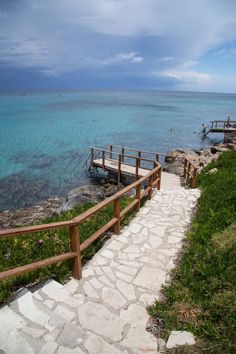 steps lead down to the water from a beach