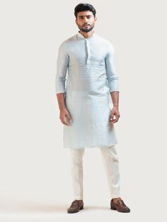 This Ice Blue Embroidered kurta set will instantly give an elegant look. This 2 piece kurta set features a bam silk ice blue kurta with zari embroidery on sleeves, front buttons fastening, and a mandarin collar. It is paired with narrow fitted pajama pants in cream color and malai cotton fabric. An ideal outfit for traditional occasions, and special events.

Size Chart For Men





	
	
					Men's Size Chart
		

		
		
						
				Size Chart For Men
				Custom Size Measurement Guide Blue Cotton Silk Kurta For Spring, Blue Cotton Silk Straight Kurta, Long Sleeve Slub Silk Sherwani For Eid, Transitional Long Sleeve Slub Silk Kurta, Blue Cotton Silk Kurta For Eid, Eid Blue Cotton Silk Kurta, Traditional Blue Sherwani For Spring, Blue Sherwani For Spring Festive Occasions, Blue Sherwani For Spring Festivities