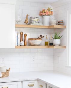 the shelves in the kitchen are filled with dishes and other things to cook for dinner