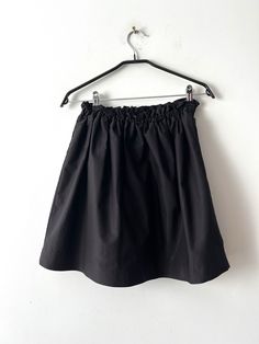 "Vintage Black Mini High Waist Skirt Back to School  Skirt Small Size Student black skirt Everyday skirt Thick skirt with stretchy waist Estimated size: S Measurements: (lying flat): Length: 18.5\"/ 47 cm Waist: 27\"/ 68.5 cm stretchy Please check measurements to insure a proper fit. Remember to allow yourself some extra room for movement. You can compare these with something from your closet that fits you well. This skirt will come to you freshly laundered and ready to wear. Please feel free contact me if you need additional measurements or have any questions Condition: very good Vintage Condition SHIPPING * I ship worldwide via Priority mail (Latvijas Pasts) from Latvia (EU). * I ship from Europe, so please allow 2 to 4 weeks for the package to arrive if you live overseas. * Europe 5 - 1 Solid Ruffled Mini Skirt, Relaxed Fit Solid Flared Skort, Black Stretch Tennis Skirt With Lining, Solid Color Flowy Full Skirt Skort, Flowy Full Skirt Solid Color Skort, Flowy Full Skirt Skort, Black Tennis Skirt With Elastic Waistband For Spring, Black Mini Tennis Skirt With Lining, Stretch Mini Skirt With Elastic Waistband