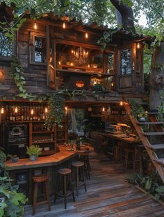 an outdoor bar with stairs leading up to the roof and lots of plants growing on it