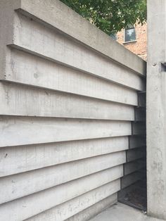 the side of a building that is made out of concrete