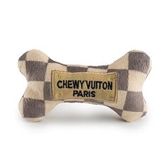 a brown and white checkered dog bone with the name chey vutton paris on it