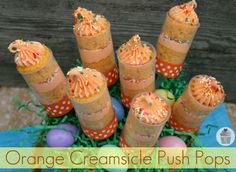 orange creamsice push pops are arranged in a basket