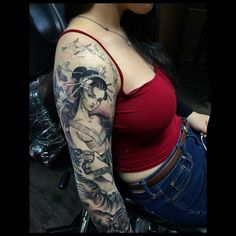 a woman with a tattoo on her arm