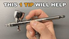 a person holding a pen with the words this 1 tip will help