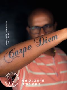 a man with a tattoo on his arm that says carp diem