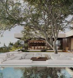 an outdoor living area next to a pool