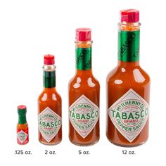 three bottles of tabasco are shown next to each other with the labels labeled in green and red