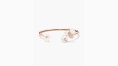 handcrafted of rose gold-tone metal and mother-of-pearl shell our precious pansy collection is true to its name. and this flex cuff is designed with lots of thoughtful details: like the sparkly crystal centers and heart-shaped petals. did you notice the larger ones? they're a nod to our signature mark. | Kate Spade Precious Pansy Flex Cuff, Cream/Rose Gold Kate Spade Elegant Bangle Jewelry, Spring Formal Rose Gold Jewelry, Elegant Rose Gold Bracelets For Spring, Elegant White Kate Spade Bracelet, Kate Spade Feminine Wedding Jewelry, Feminine Kate Spade Jewelry For Wedding, Spring Gift Jewelry By Kate Spade, Feminine Kate Spade Wedding Jewelry, Kate Spade Rose Gold Bracelet Gift